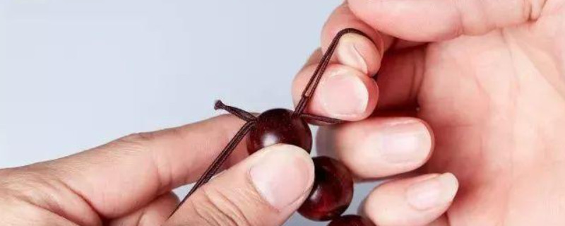 文玩手串怎么打死结